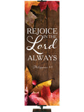 Rejoice in the Lord Always Philippians 4:4 Autumn Heartland Design A Left Rustic dark brown vertical wood planks autumn maple leaves, 4 leaves in top left corner