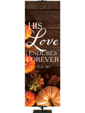 His Love Endures Forever Psalm 136:1 Autumn Heartland Design D Right rustic dark brown horizontal wood planks with multicolor pumpkins and autumn decor on left side