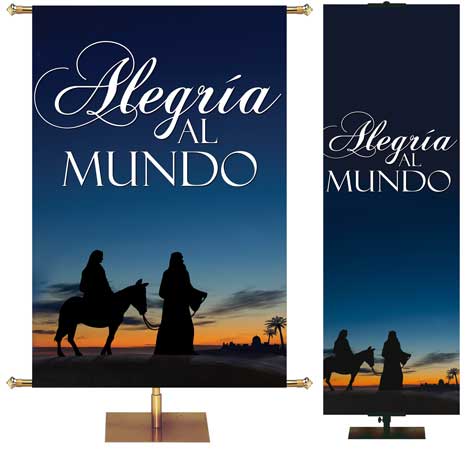 Alegria al mundo Church Banner in Spanish with Silhouette of Mary on a donkey being led by Joseph against a desert sunset sky