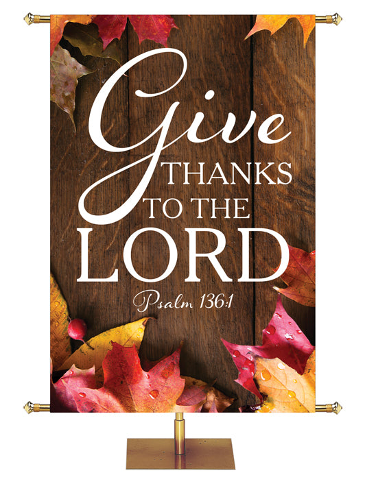 Give Thanks to the Lord Psalm 136:1 Autumn Heartland Design A Left Rustic dark brown vertical wood planks autumn maple leaves, 4 leaves in top left corner