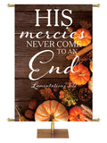 His Mercies Never End Lamentations 3:22 Autumn Heartland Design D Left rustic dark brown horizontal wood planks with multicolor pumpkins and autumn decor on right side