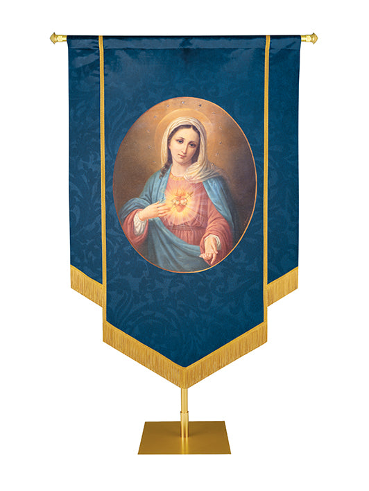 Dark blue fabric Catholic church banner with an oval portrait of The Blessed Virgin Mary pointing to the symbol of her Immaculate Sacred Heart hand trimmed with gold fringe along the bottom and gold braid. 