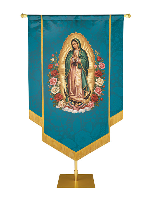 Catholic church banner.  The Blessed Virgin Mary with her hands clasped in prayer surrounded by a radiant golden sunburst, teal, hand embellished with gold braid and fringe.