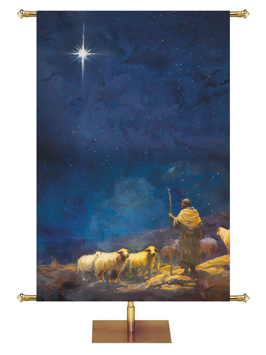 Christmas Church Banner with the New Star overlooking the Shepherd and his flock (right) on a peacful blue background.