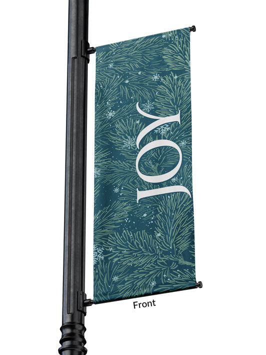 Outdoor Light Pole Banner Joy in White letters on Blue background of Evergreen branches