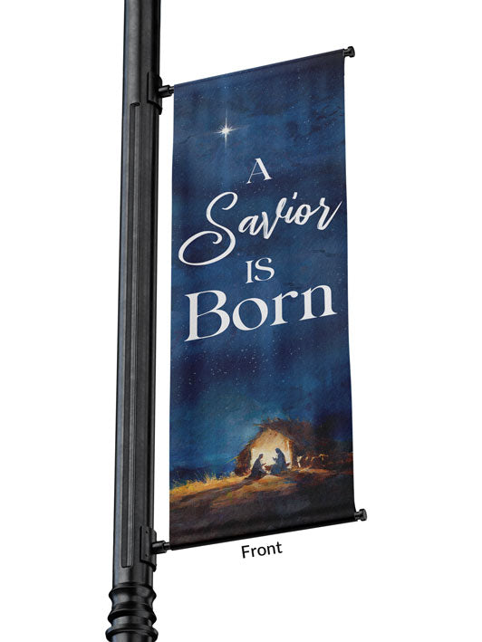 Outdoor Light Pole Banner A Savior is Born in White Letters on Night Sky background with the New Star and The Manger Scene