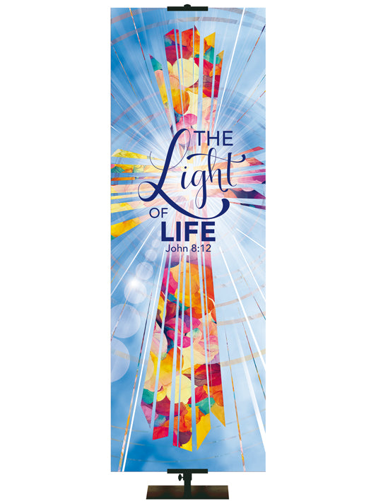 The Light of Life. John 8:12. Radiant Cross Design (left format) in Multicolor on Blue