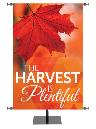 The Harvest is Plentiful with Red Leaf on orange Church Banner for Thanksgiving and Autumn