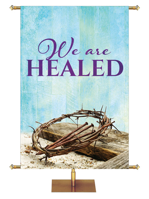 Easter Banner for Church We Are Healed with Crown of Thorns, Cross and Nails (Right) on blue rustic background