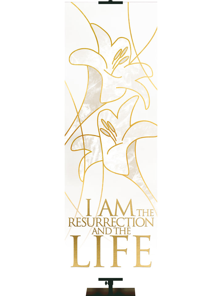 Easter Liturgy I Am The Resurrection on White Banner with two Easter Lily Blooms left above right outlined in gold in thin banner format
