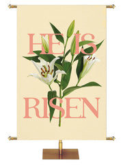 Church Banner for Easter He Is Risen. Gold Lettering and White Easter Lily Blooms with Green Leaves and Buds on Yellow Banner