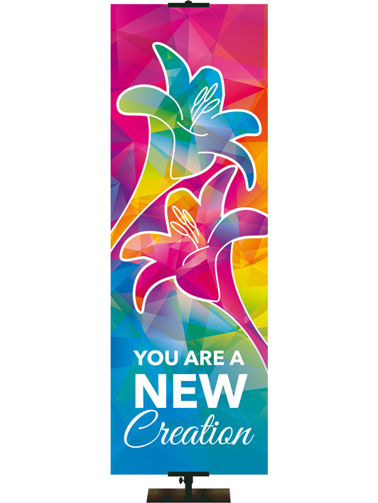 You Are A New Creation Hues of Grace Church Banner with brilliantly multicolored Lily Symbol in left side thin format
