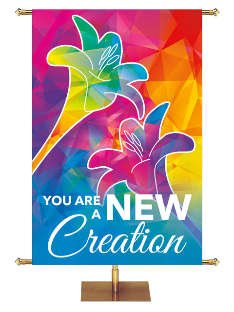You Are A New Creation Hues of Grace Church Banner with brilliantly multicolored Lily Symbol in left side wide format