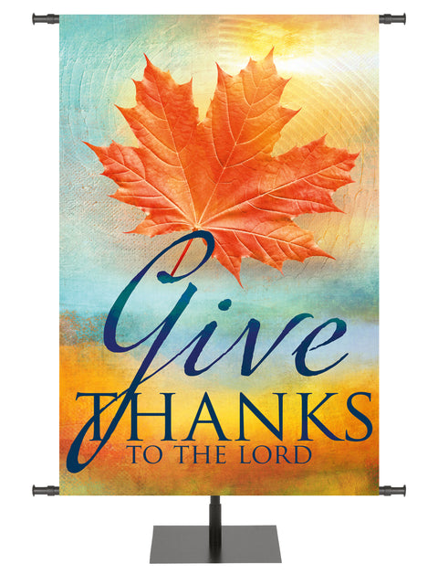 A Joyous Autumn Banner Give Thanks To The Lord with rust Maple Leaf on watercolor background