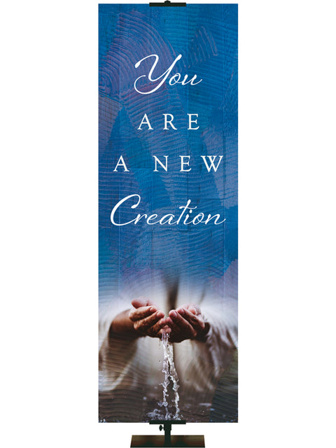 You Are A New Creation Living Hope Church Banner with Water flowing through hands on blue