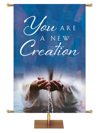 You Are A New Creation Living Hope Church Banner with Water flowing through hands on blue
