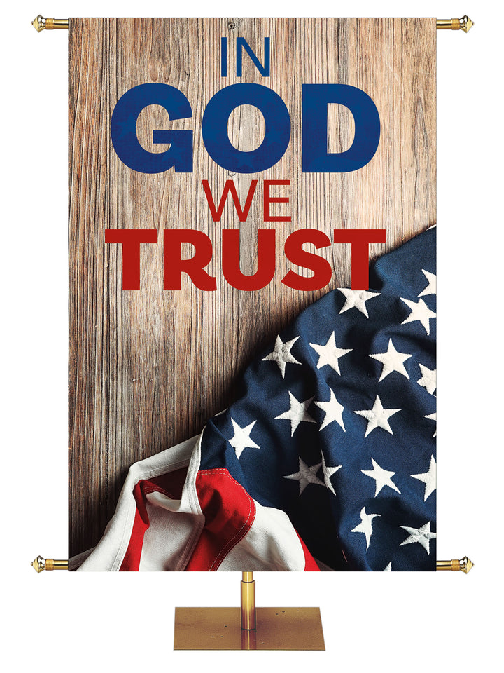 Patriotic Banner with U.S. Flag draped on Barn Wood with the phrase In God We Trust
