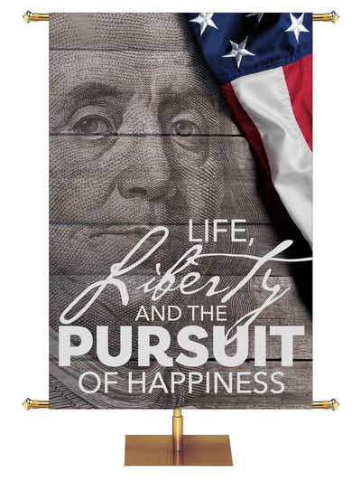 Patriotic Banner featuring the illustrated face of Benjamin Franklin and quote Life, Liberty and the Pursuit of Happiness.