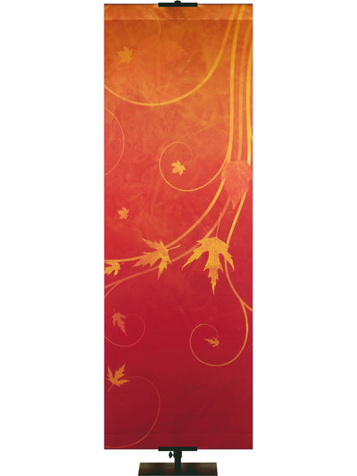 Fabric banner in red and gold tones with autumn leaves.