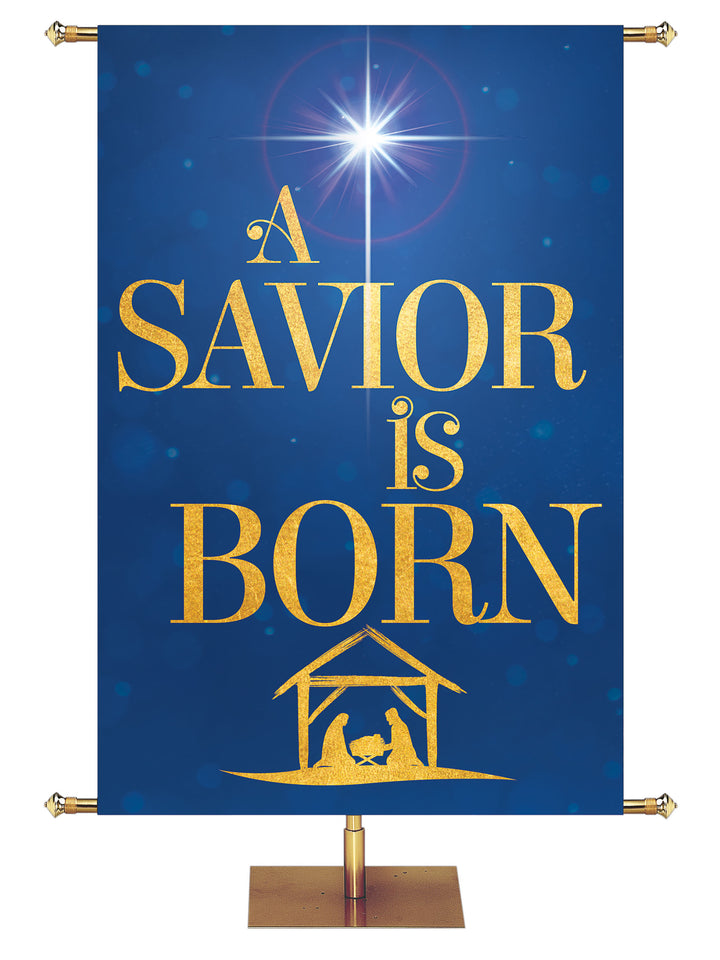 Church Banner for Christmas A Savior is Born with New Star above Nativity with sparkling gold graphics in red, blue, purple and green and nine sizes